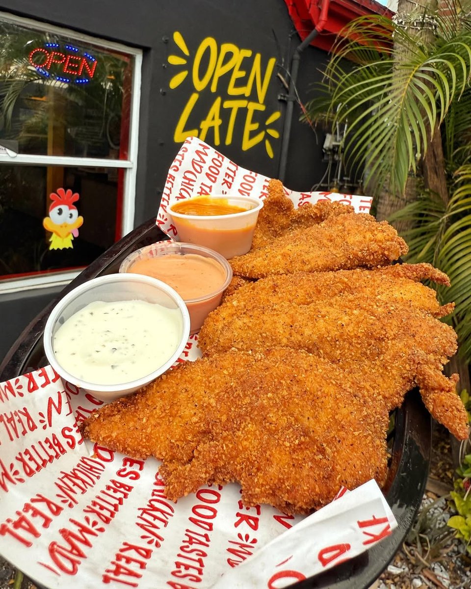 Tenders and sauces under an Open Late sign
